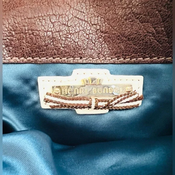 Henri Bendel leather fold over asymmetrical slim clutch